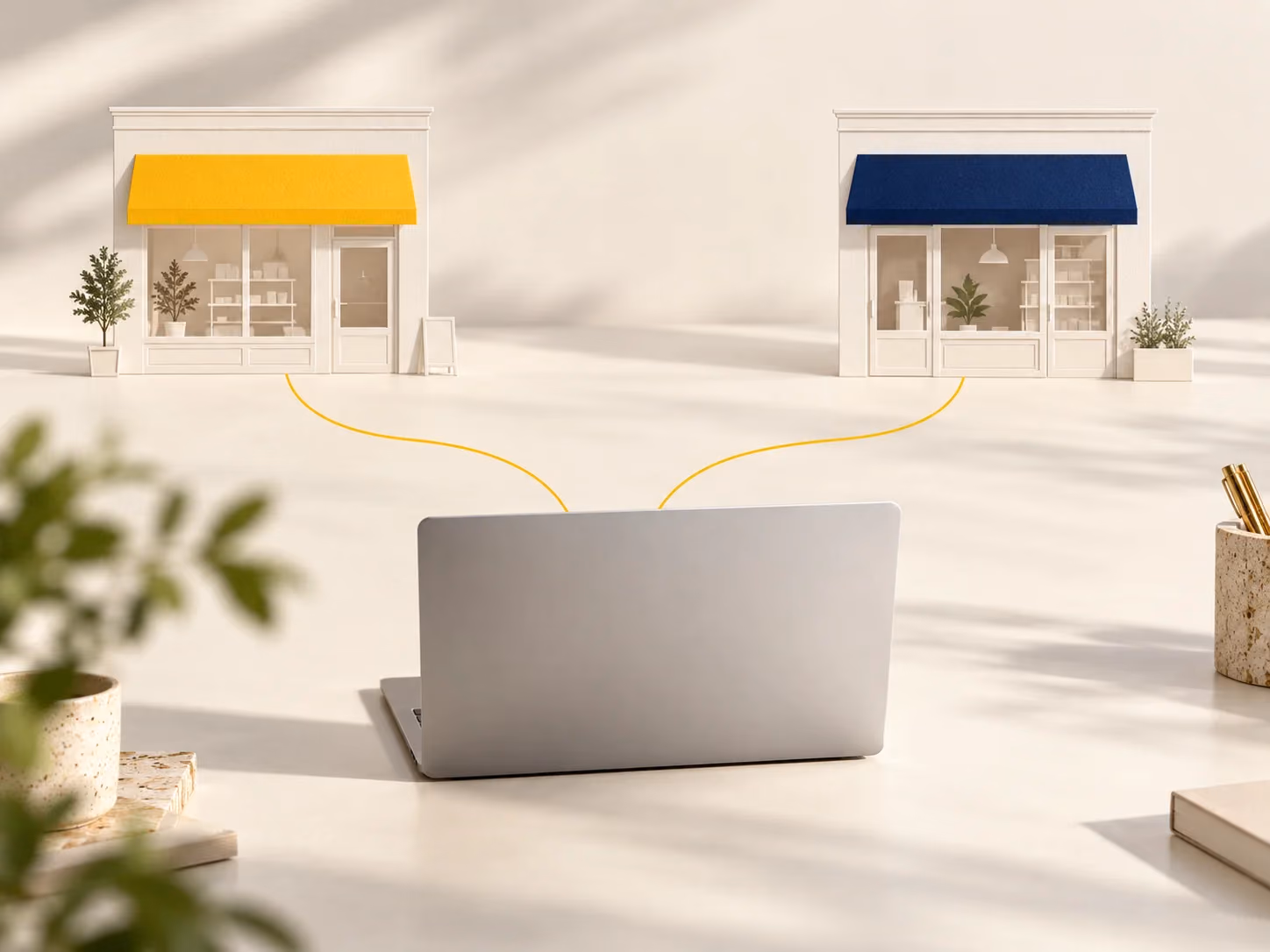 Two storefronts connected to a single laptop workspace.