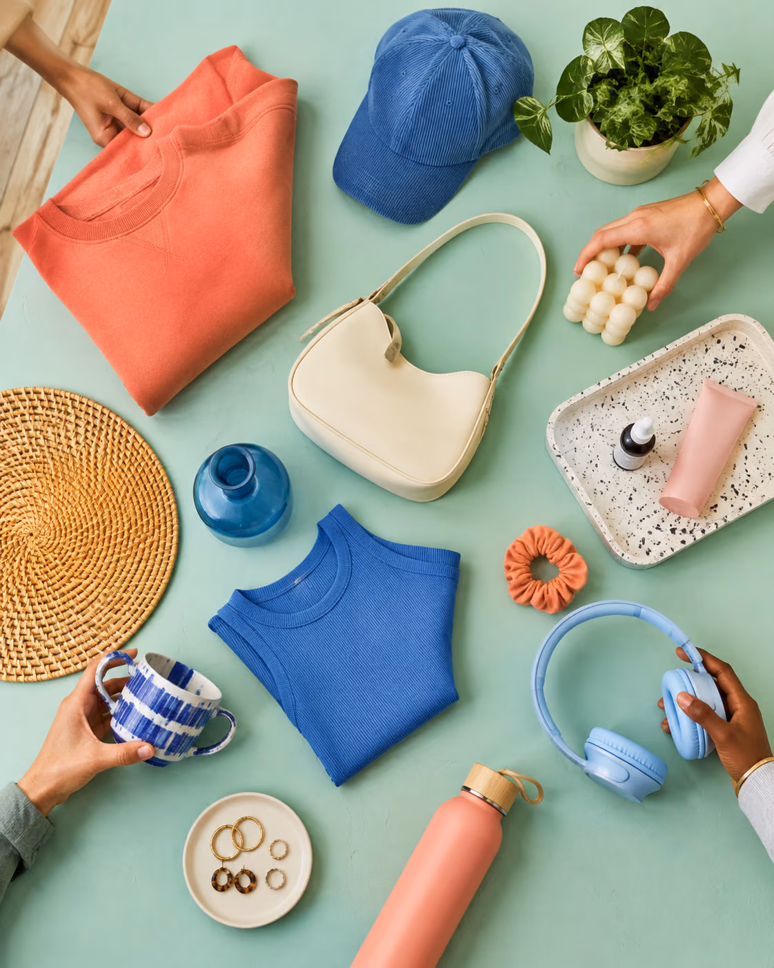 A colorful range of apparel, home, beauty, and accessory products fills a sourcing table.